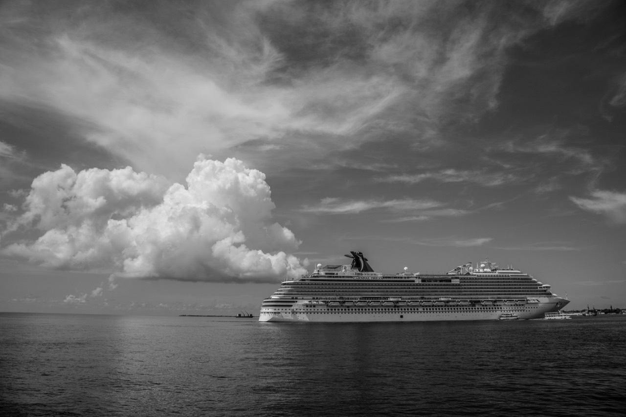 A family enjoying golden-hour on a cruise deck